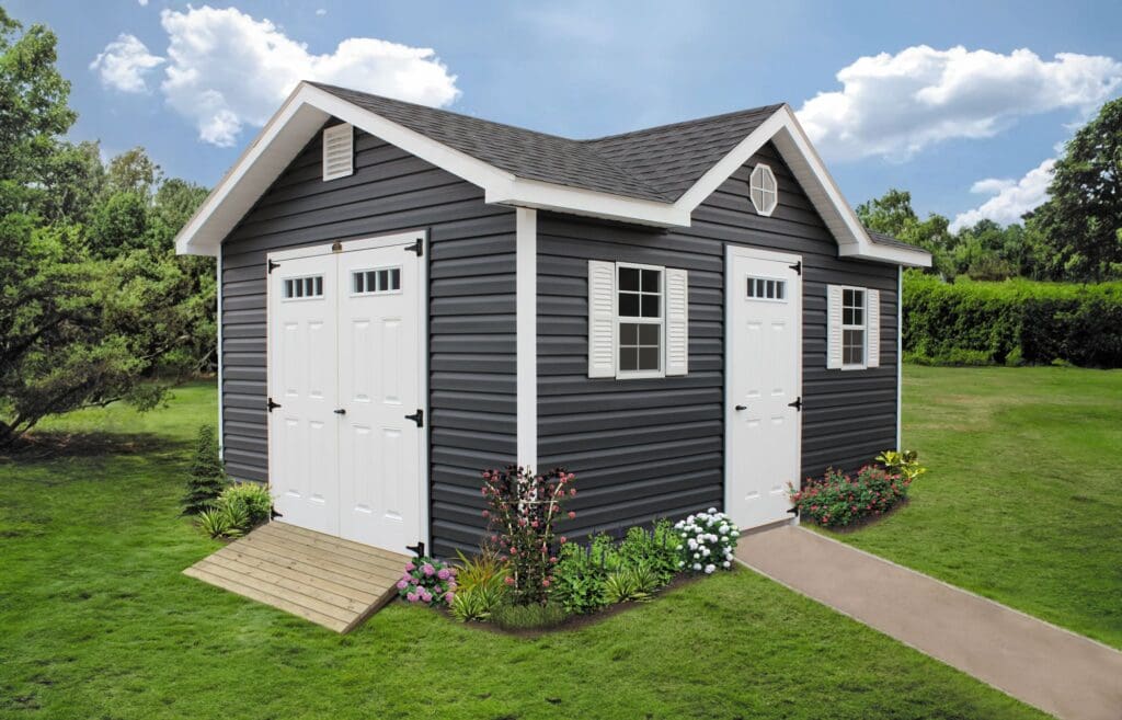 Gray shed with white trim, a dormer and a ramp.
