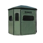 Redneck hunting blind with dark green exterior.