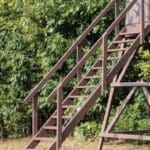 Steps with railing on redneck hunting blind.