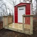 Redneck hunting cabin with patio in the woods.