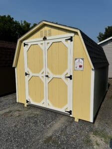 shed with Charcoal shingles, cream exterior, white trim, diamond plate