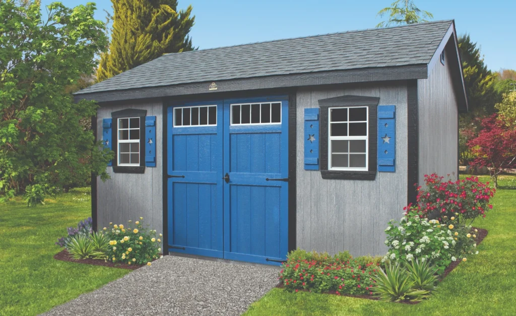 Gray A-frame shed with blue doors and shutters.